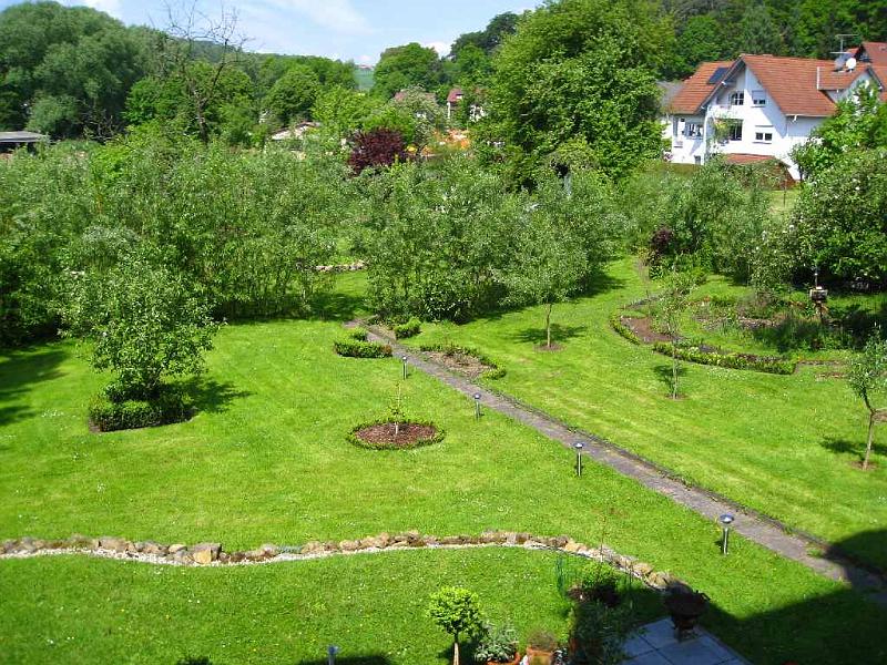 09.JPG - The large yard is now divided by a willow hedge so that the park now has a dual nature.